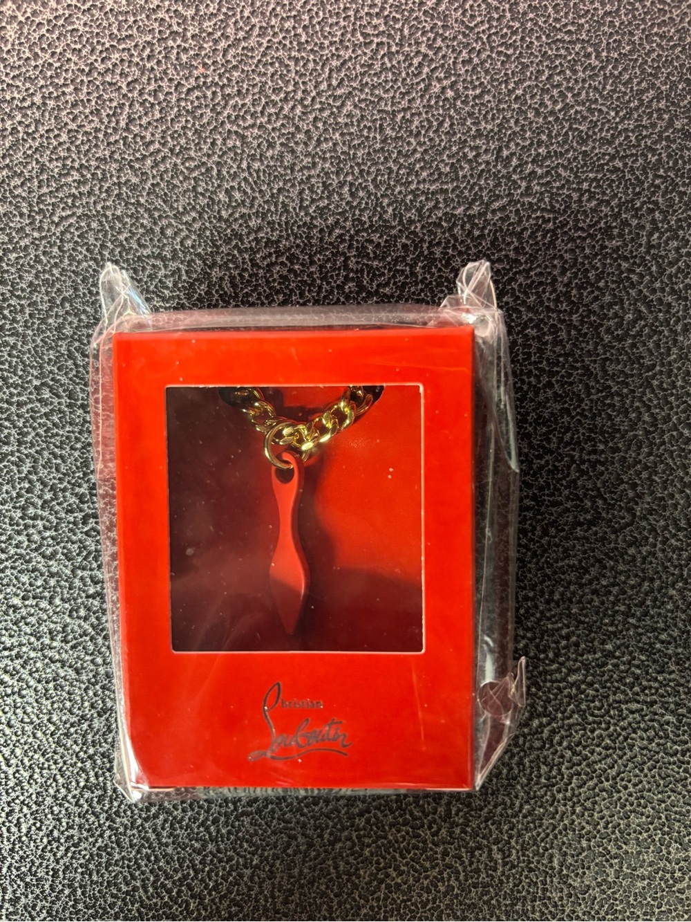 Christian Louboutin chain and charm